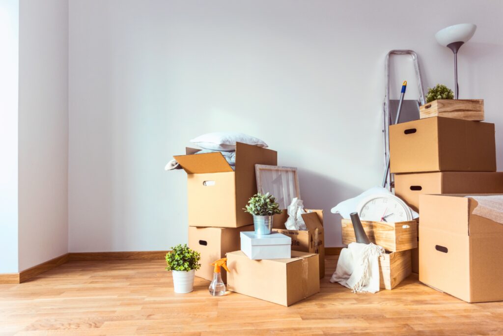 Move. Cardboard boxes and cleaning things for moving into a new